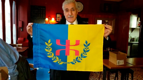 President Ferhat Mehenni, sporting the official flag of the Kabyle
